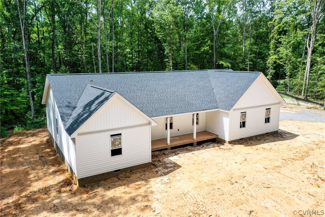 19173 Teman Road Beaverdam, VA 23015 - Photo 8 of 35 a view of a white house with a yard