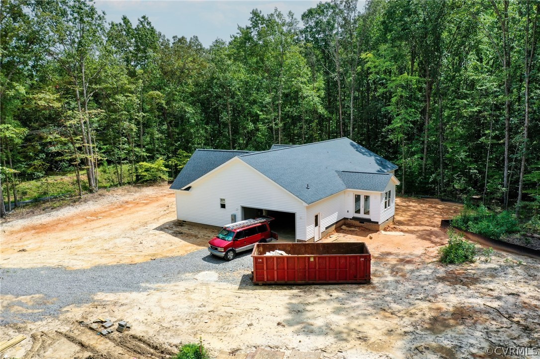 19173 Teman Road Beaverdam, VA 23015 - Photo 10 of 35 a front view of a house with cars parked