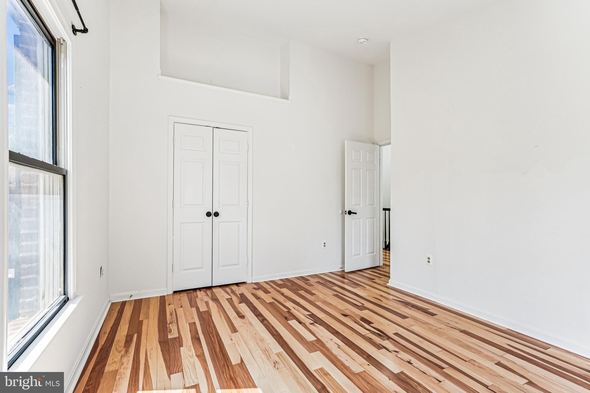 120 Ridgepoint Place Gaithersburg, MD 20878 - Photo 22 of 51 a view of a room with wooden floor and a bathroom