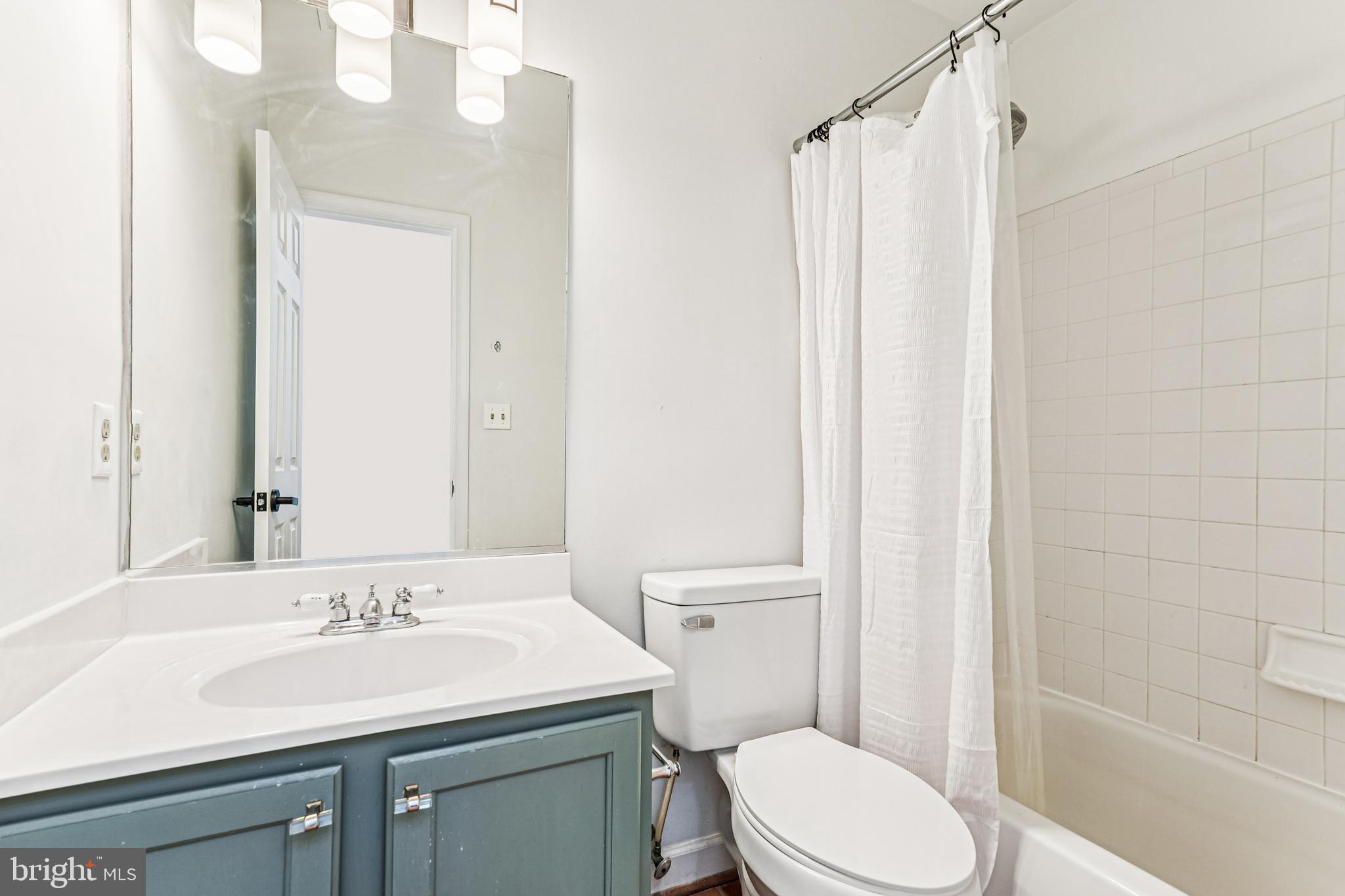 120 Ridgepoint Place Gaithersburg, MD 20878 - Photo 23 of 51 a bathroom with a sink a toilet and shower