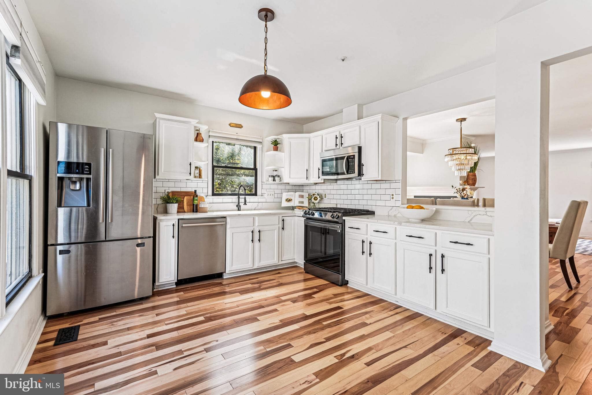 120 Ridgepoint Place Gaithersburg, MD 20878 - Photo 3 of 51 a kitchen with a refrigerator cabinets and wooden floor