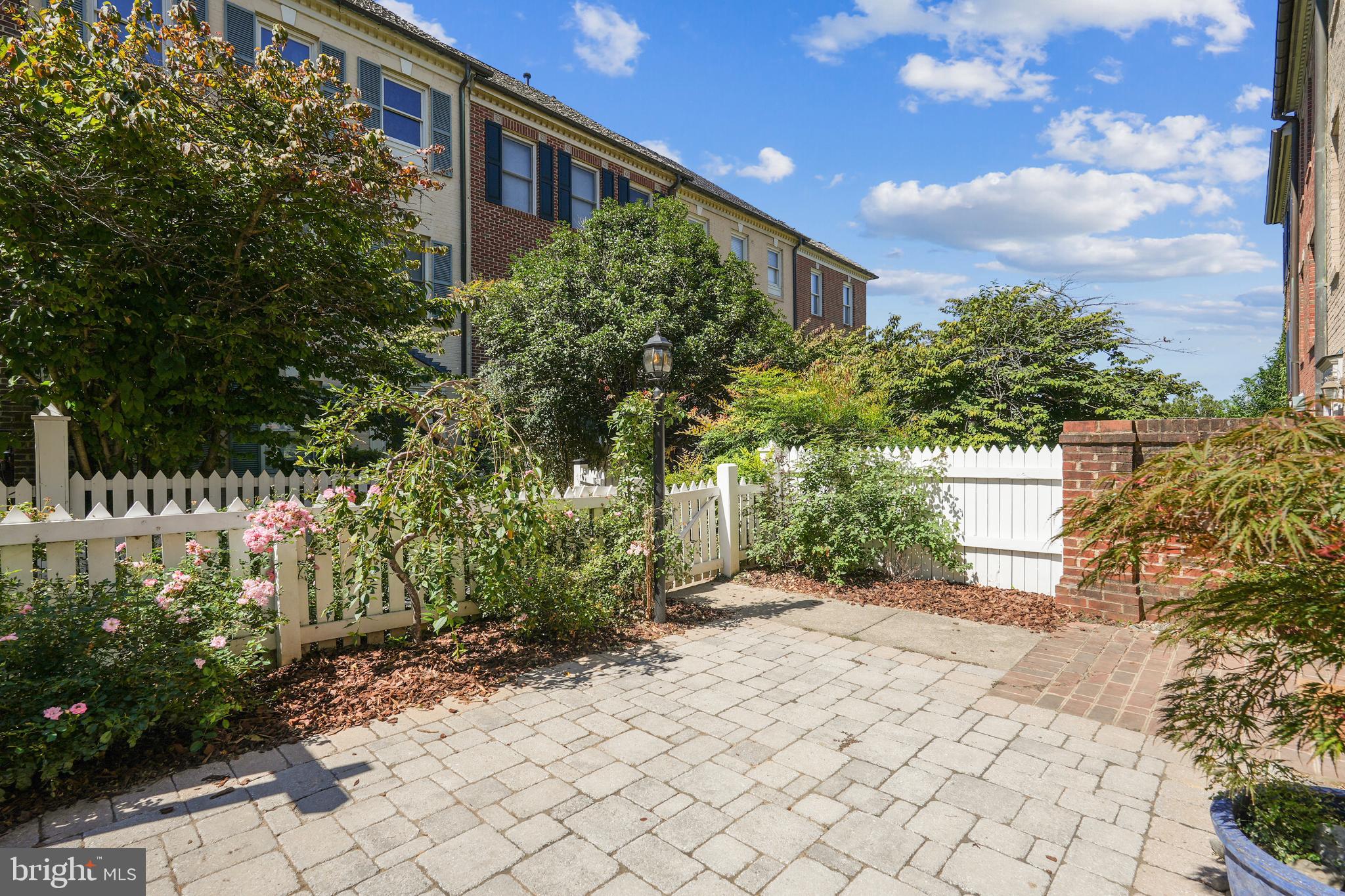 120 Ridgepoint Place Gaithersburg, MD 20878 - Photo 32 of 51 a backyard of a house with lots of green space