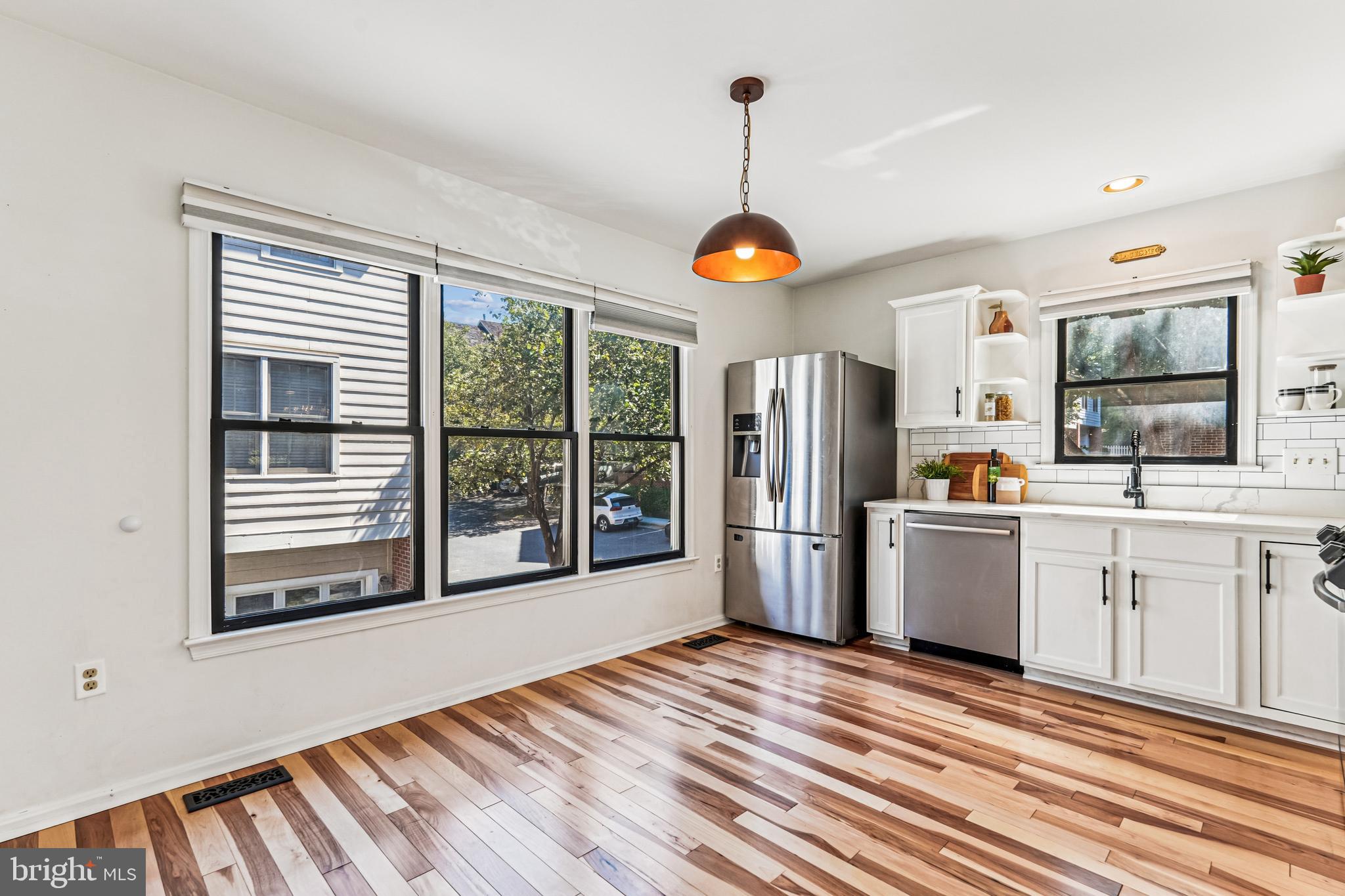 120 Ridgepoint Place Gaithersburg, MD 20878 - Photo 4 of 51 a kitchen with stainless steel appliances granite countertop a refrigerator and microwave