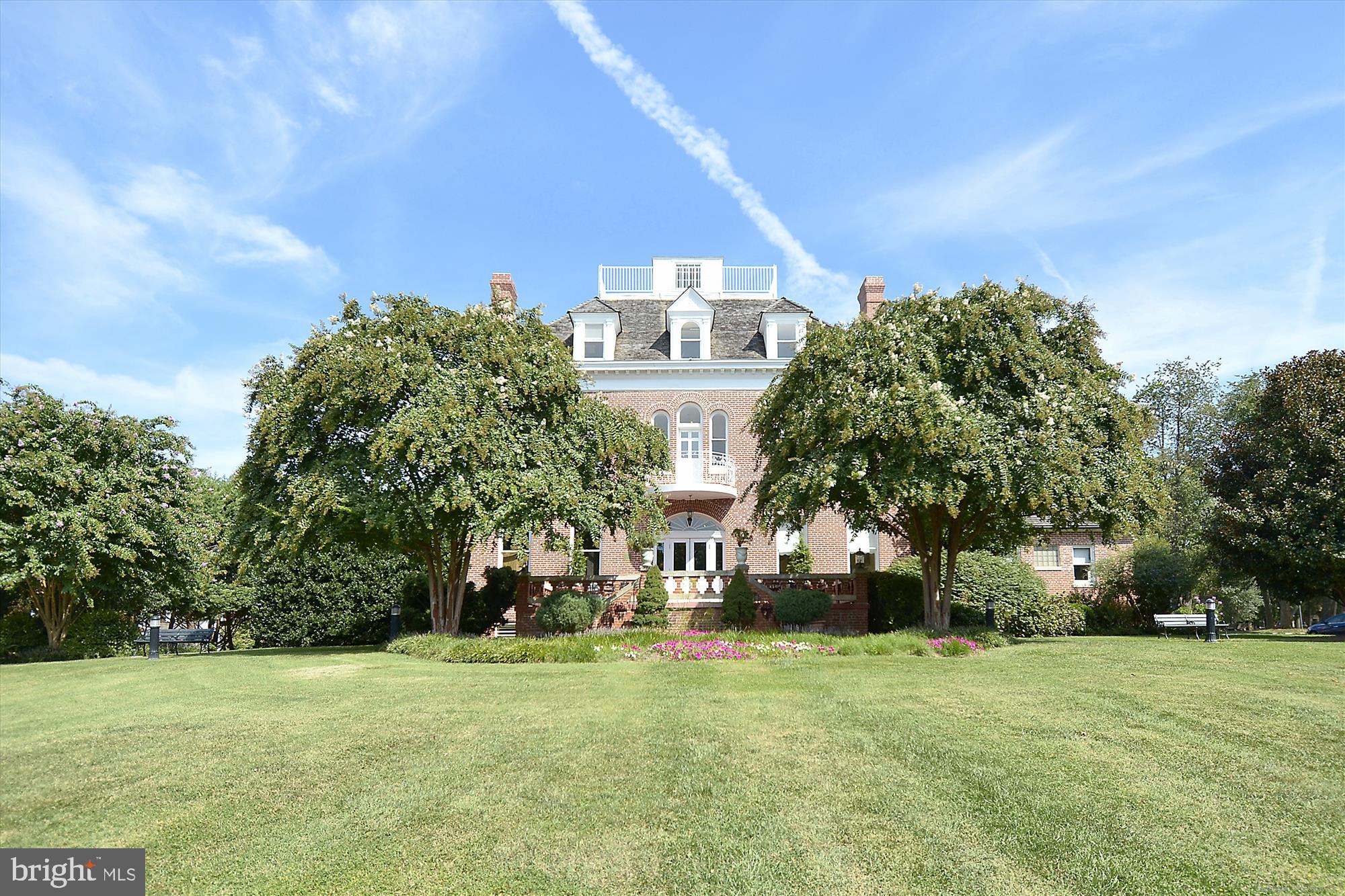 120 Ridgepoint Place Gaithersburg, MD 20878 - Photo 49 of 51 a front view of a building with a garden