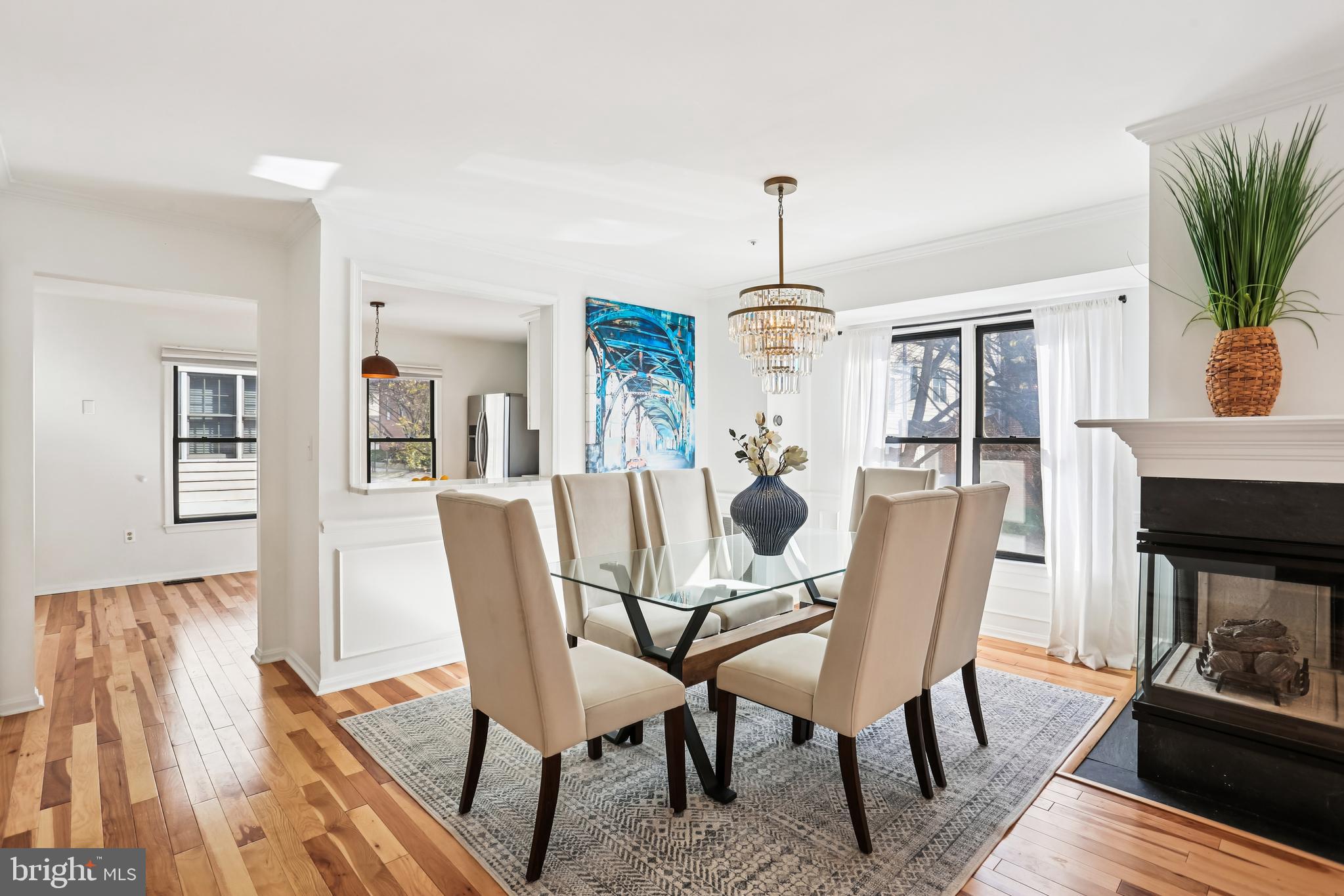120 Ridgepoint Place Gaithersburg, MD 20878 - Photo 8 of 51 a dining room with furniture a chandelier and wooden floor
