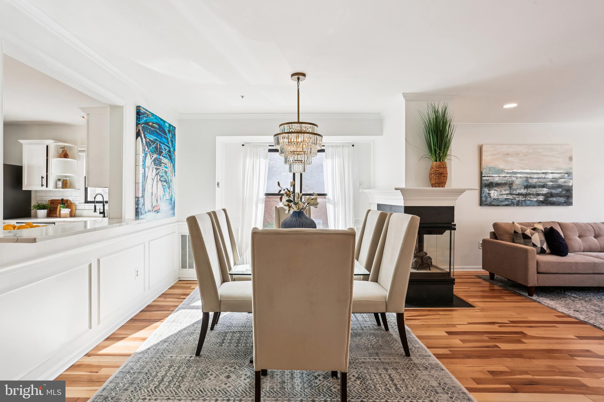 120 Ridgepoint Place Gaithersburg, MD 20878 - Photo 9 of 51 a dining room with furniture a chandelier and wooden floor