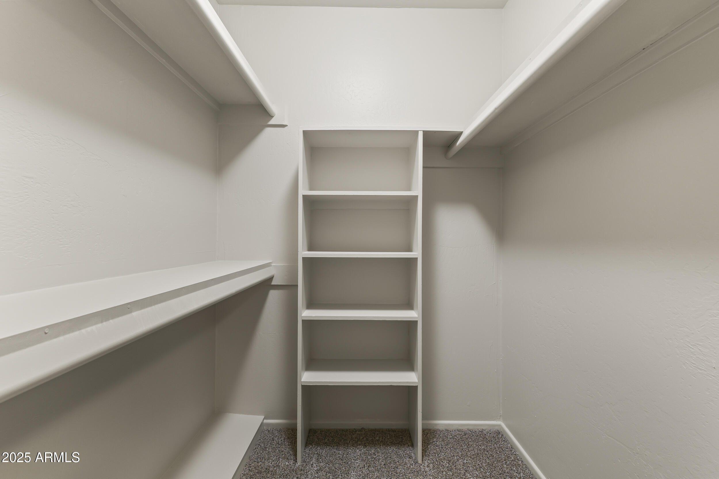 6835 North 1st Place Phoenix, AZ 85012 - Photo 13 of 42 a view of an empty walk in closet