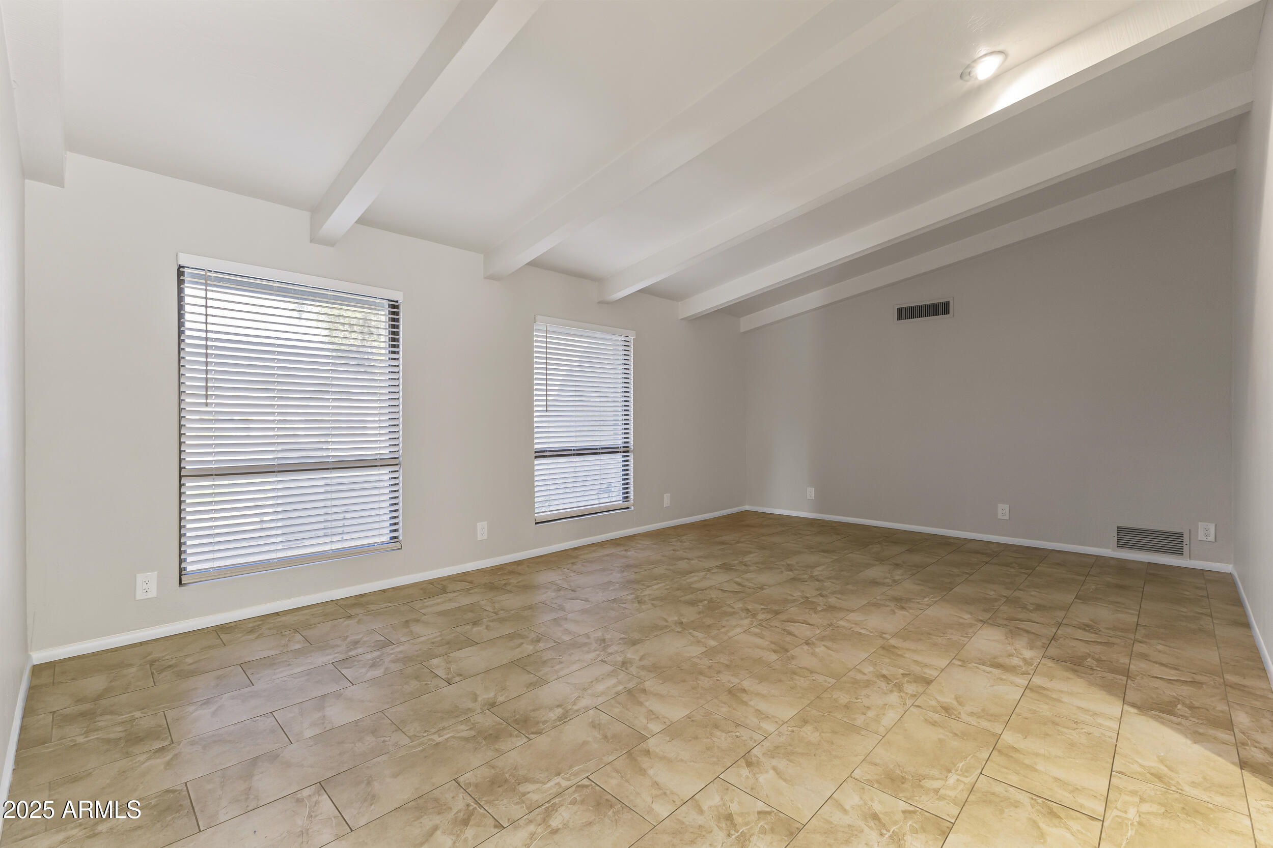6835 North 1st Place Phoenix, AZ 85012 - Photo 16 of 42 a view of an empty room with a window