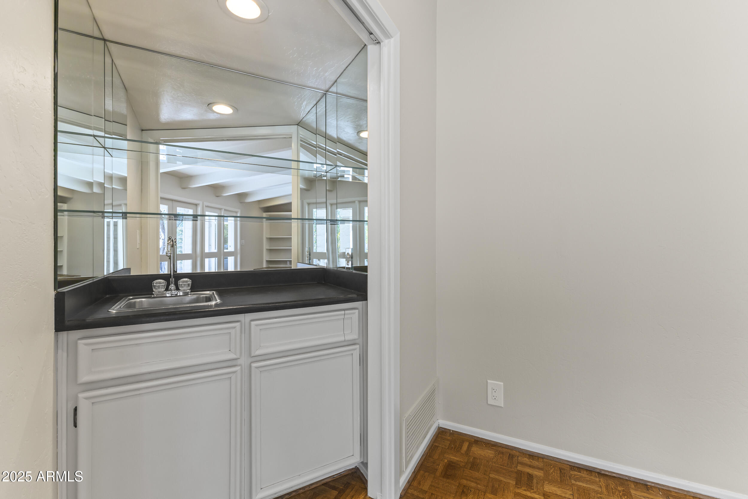 6835 North 1st Place Phoenix, AZ 85012 - Photo 20 of 42 a bathroom with a granite countertop sink and a mirror