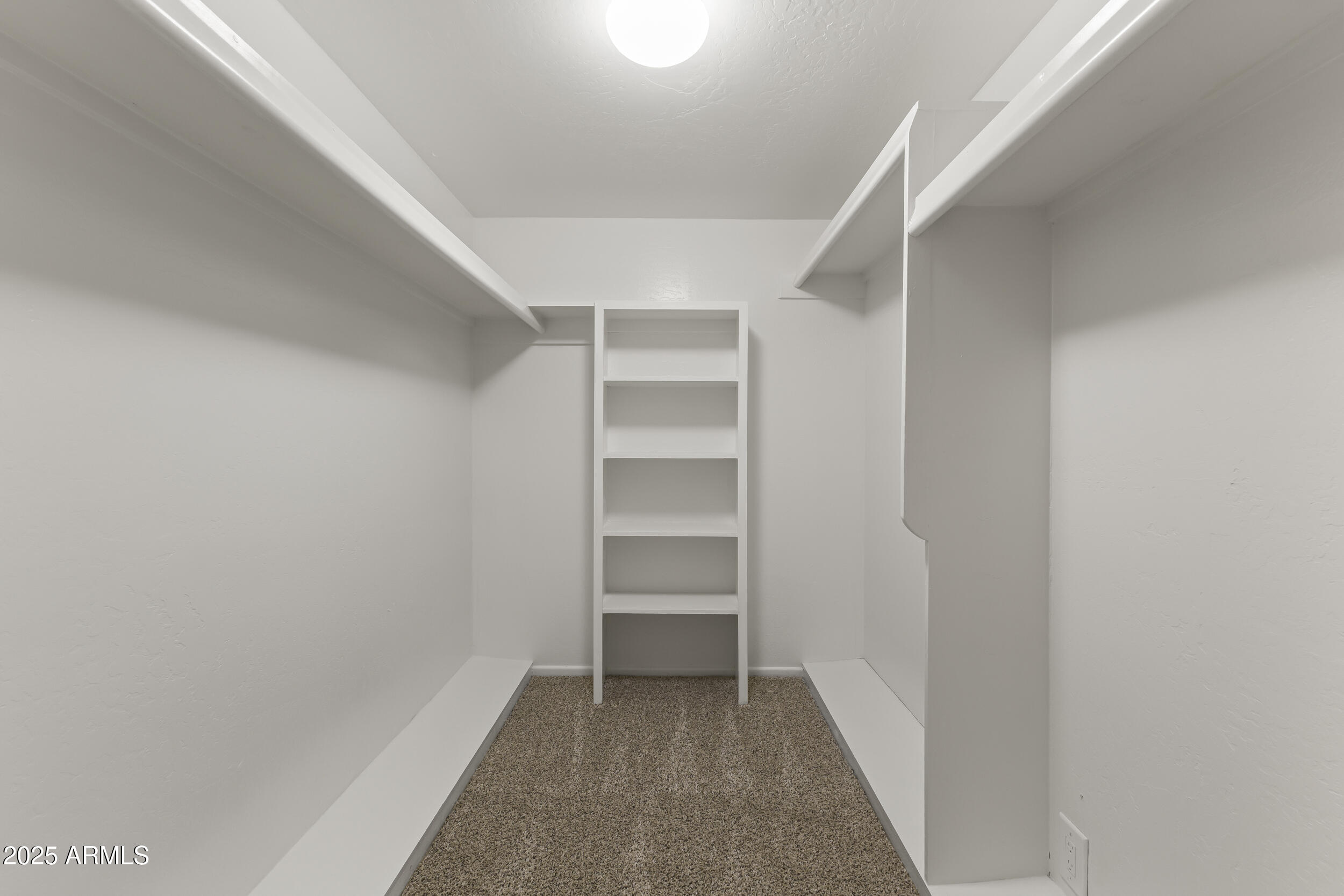 6835 North 1st Place Phoenix, AZ 85012 - Photo 27 of 42 a view of an empty walk in closet