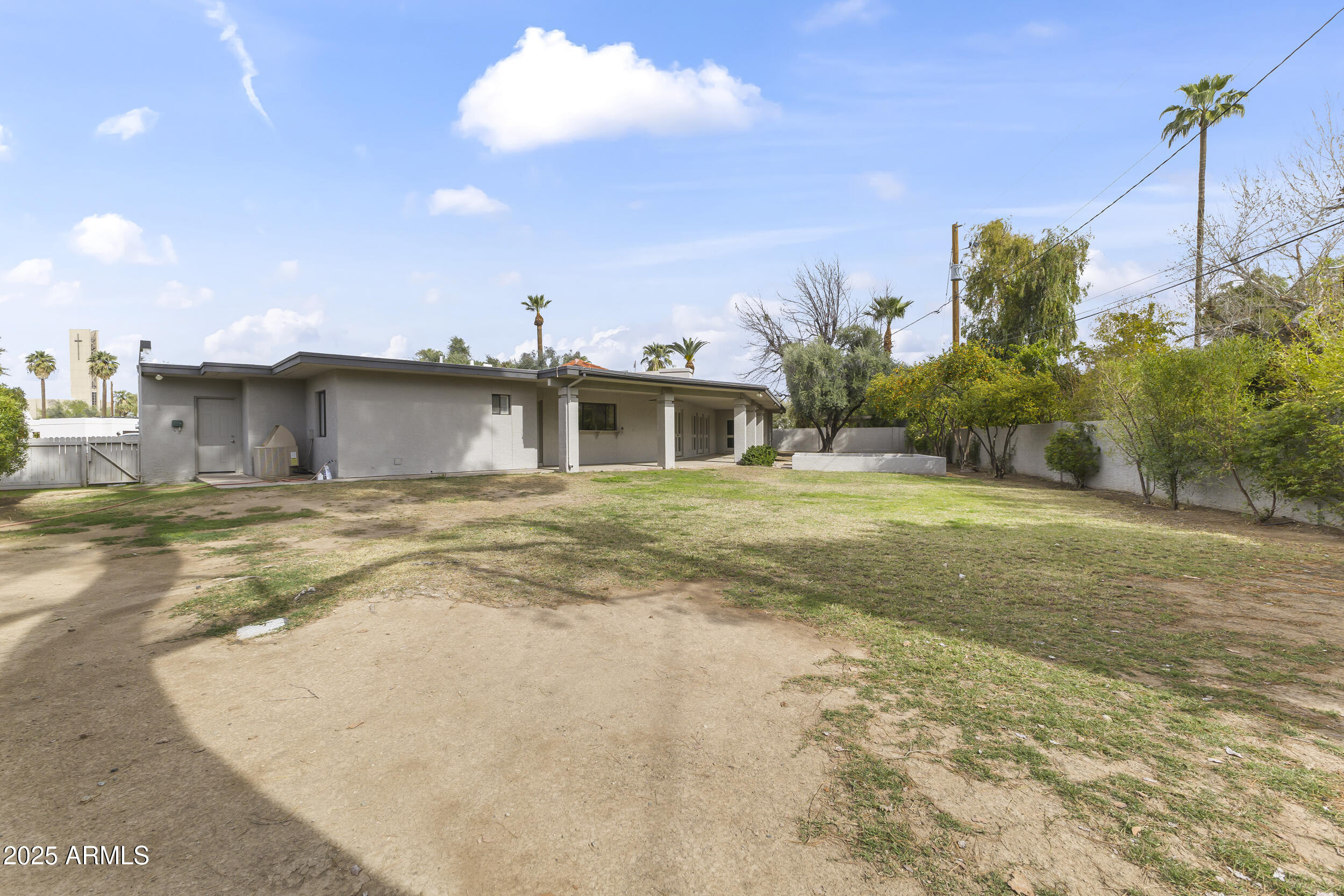 6835 North 1st Place Phoenix, AZ 85012 - Photo 35 of 42 a view of a house with a yard