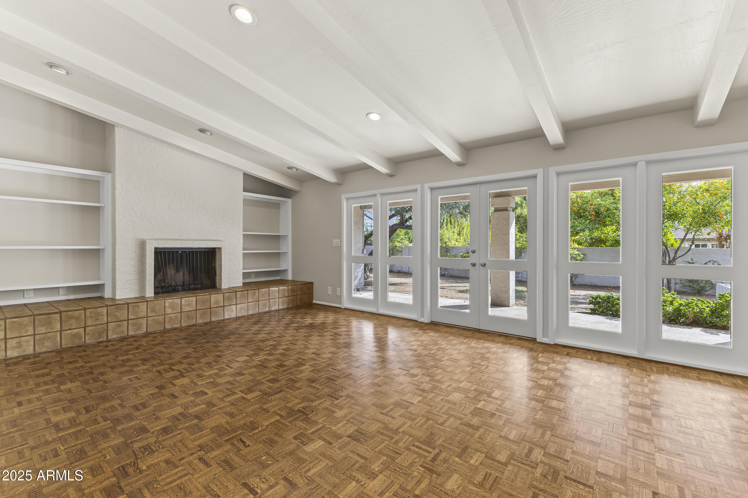 6835 North 1st Place Phoenix, AZ 85012 - Photo 4 of 42 a view of room with window and wooden floor