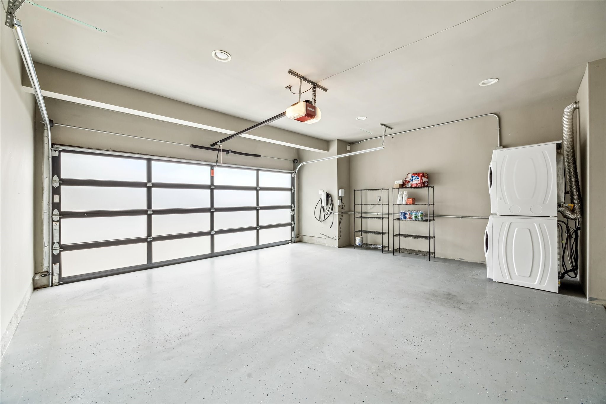 808 Coronado Street Houston, TX 77009 - Photo 47 of 50 Unit 2, two-car garage with frosted panel door and additional storage space.
