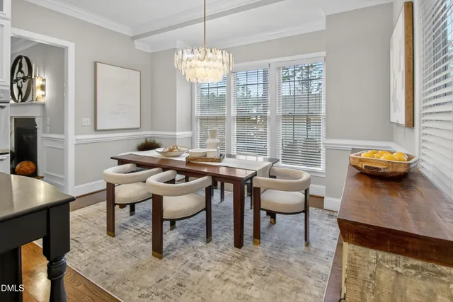 a spacious bedroom with a bed and a flat screen tv