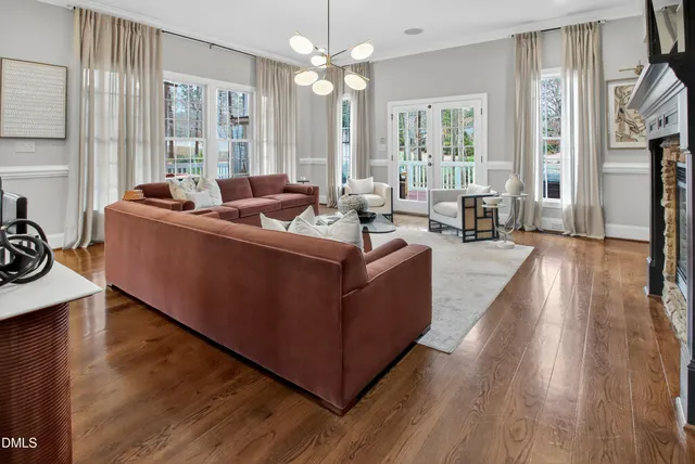 a view of balcony with wooden floor and outdoor seating
