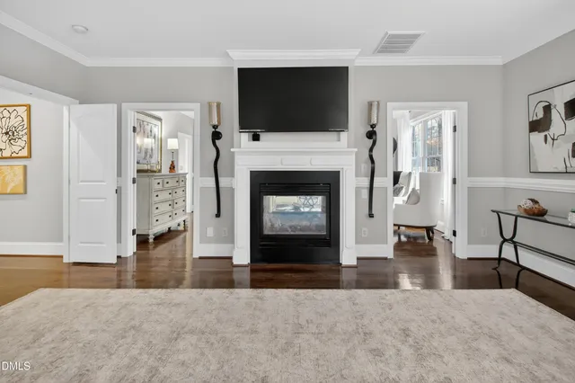a bedroom with a bed and ceiling fan