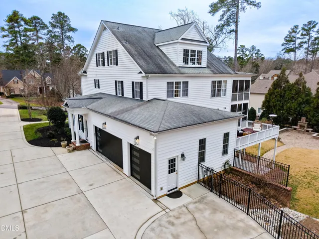 an aerial view of a house with outdoor space