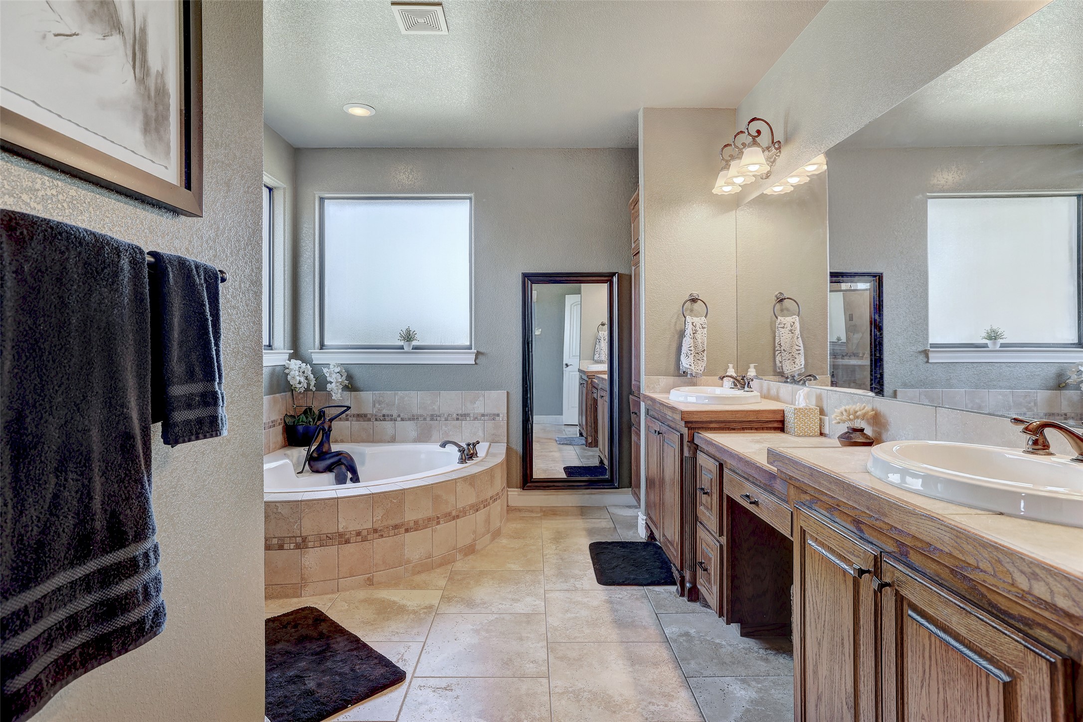 Undisclosed Address Georgetown, TX 78633 - Photo 23 of 39 a spacious bathroom with a bathtub sink and mirror