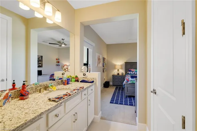 a bedroom with a bed and a dresser in it