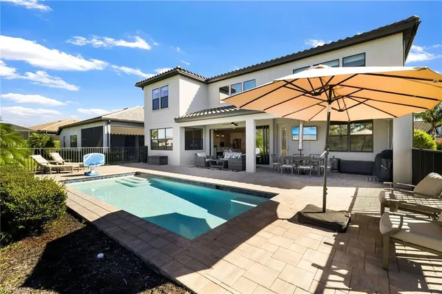 a bathroom with a sink mirror and toilet