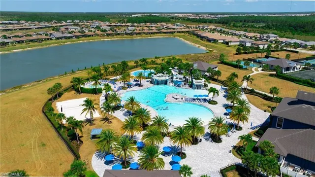 an aerial view of a houses with a lake view