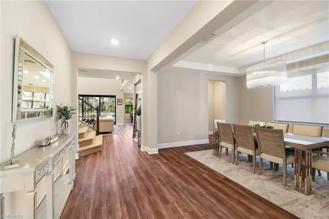 a view of a dining room with furniture wooden floor and a rug
