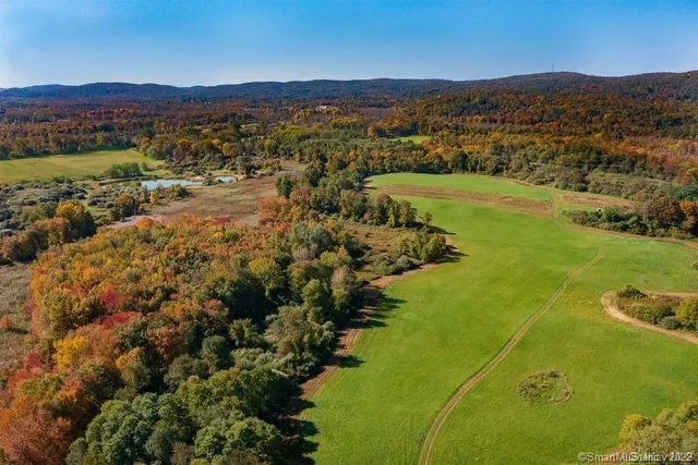 an aerial view of residential house with outdoor space and river