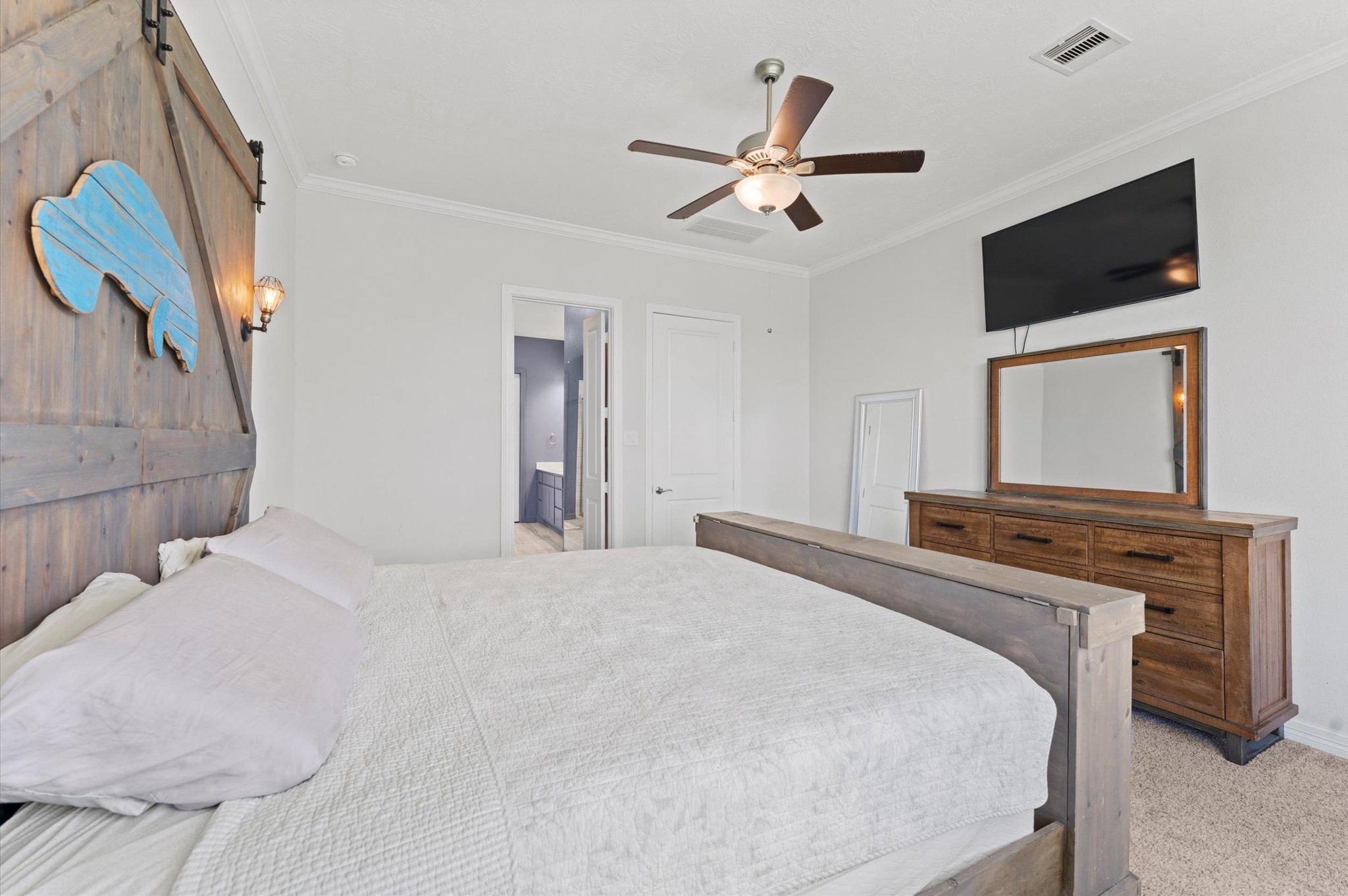 3510 Whitman Drive Rosharon, TX 77583 - Photo 9 of 25 This bedroom has a ceiling fan, carpeted floor, and light walls, creating a cozy and inviting atmosphere.