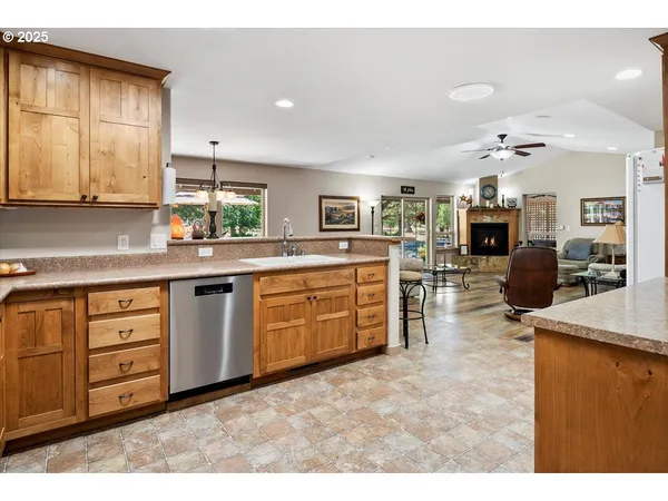 a kitchen with sink stove and cabinets