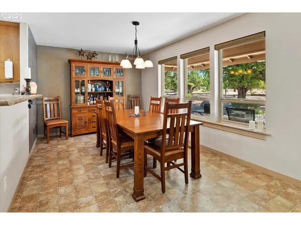 a view of a dining room with furniture window and outside view