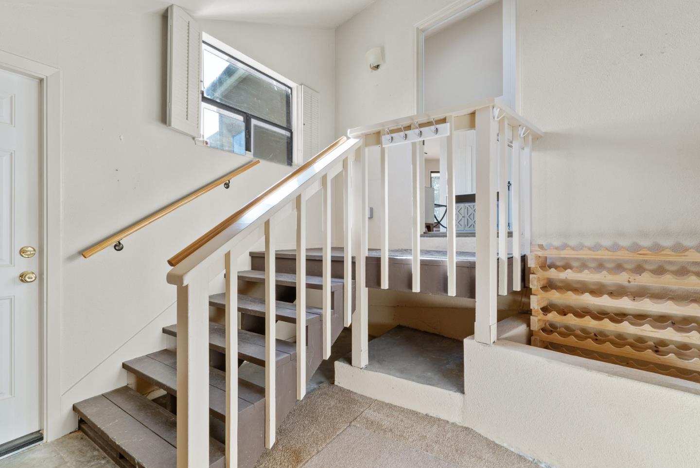 925 Skyward Drive Aptos, CA 95003 - Photo 34 of 95 a view of staircase with white walls and a window