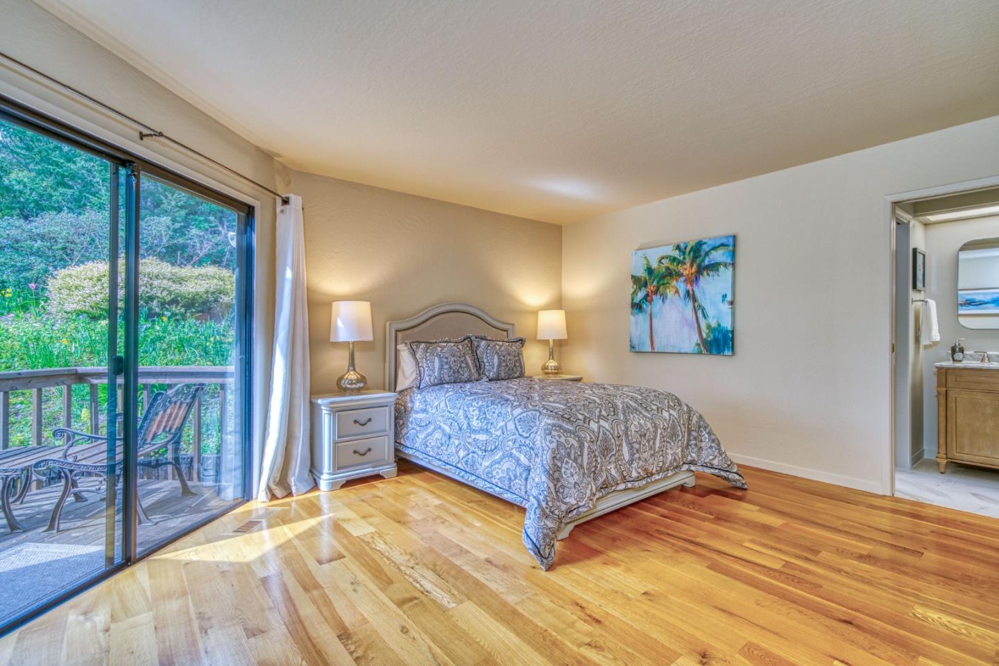 925 Skyward Drive Aptos, CA 95003 - Photo 38 of 95 a bedroom with a large bed and a large window