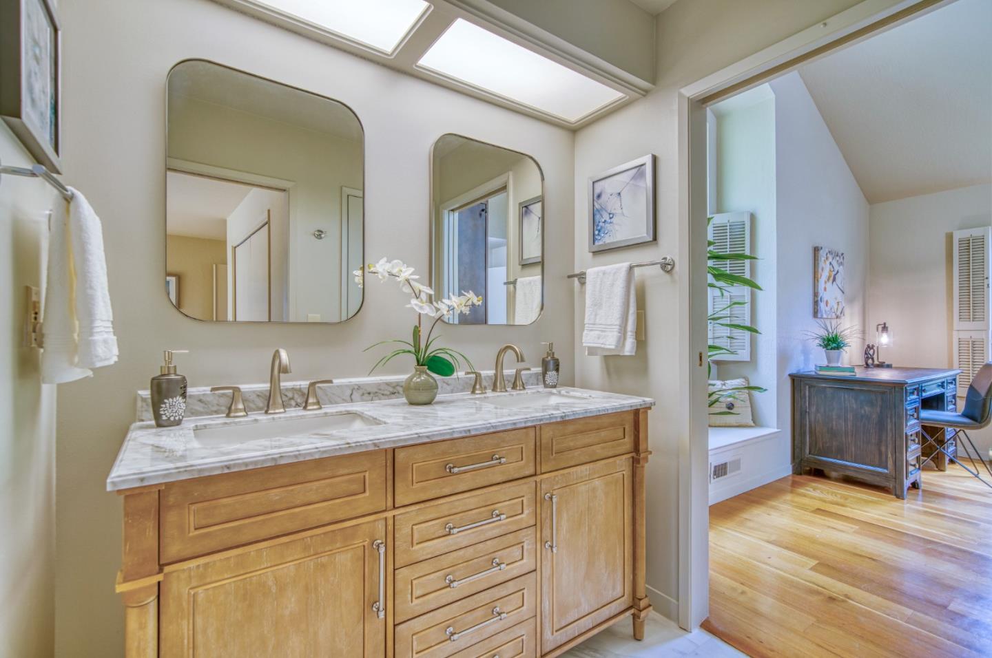 925 Skyward Drive Aptos, CA 95003 - Photo 40 of 95 a en suite bathroom with a double vanity sink and a mirror