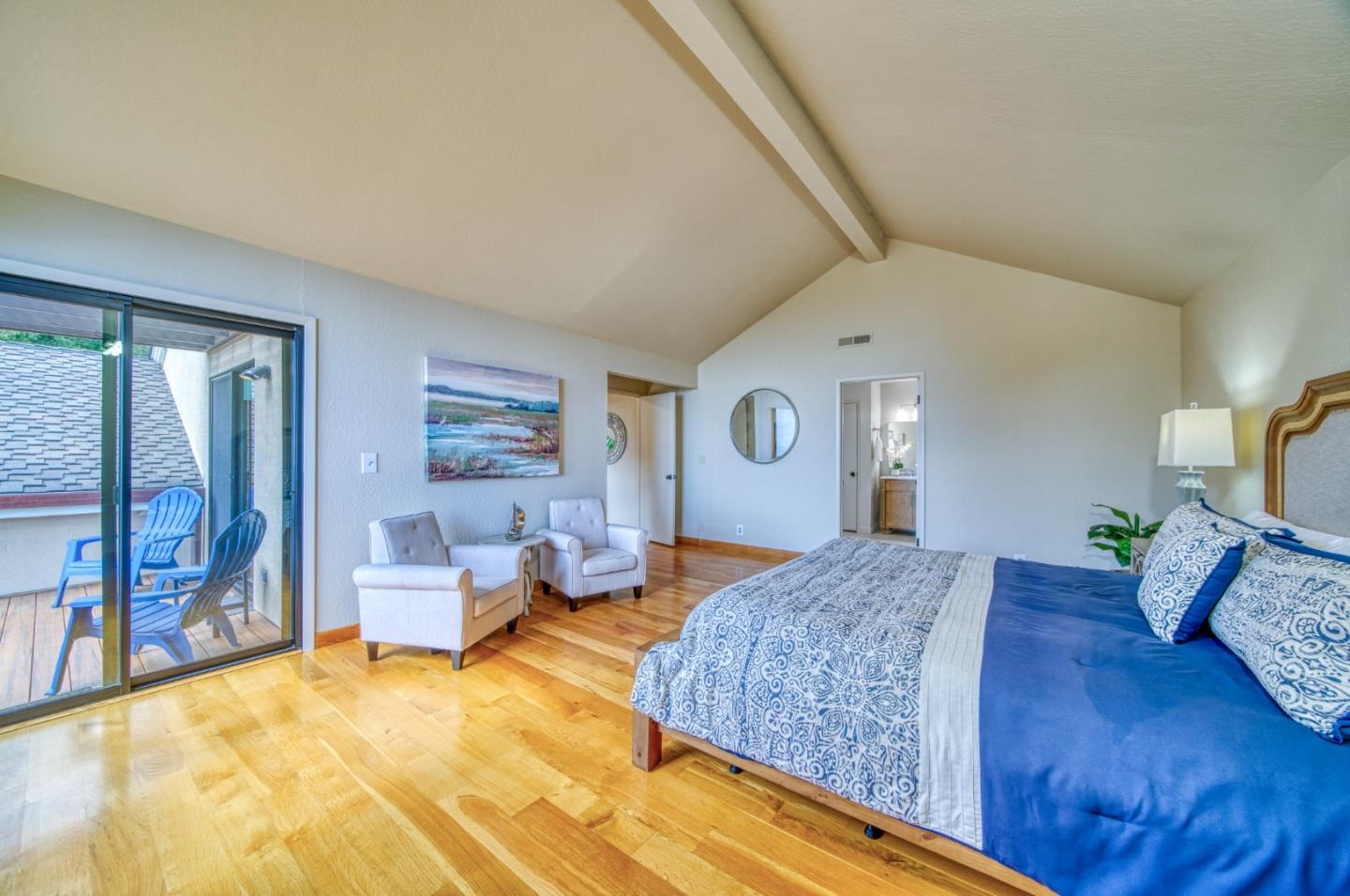 925 Skyward Drive Aptos, CA 95003 - Photo 54 of 95 a spacious bedroom with a bed and dresser with rug