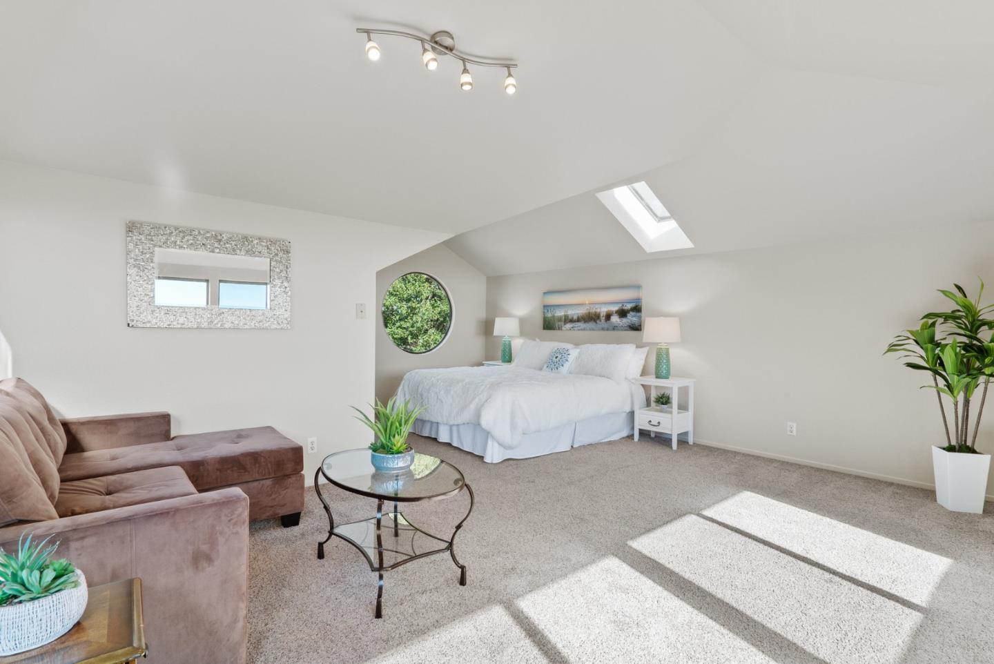 925 Skyward Drive Aptos, CA 95003 - Photo 67 of 95 a living room with furniture and a potted plant
