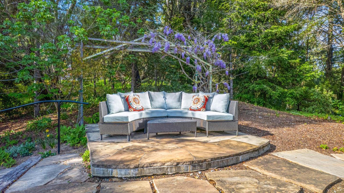 925 Skyward Drive Aptos, CA 95003 - Photo 77 of 95 a view of a patio with table and chairs and wooden fence