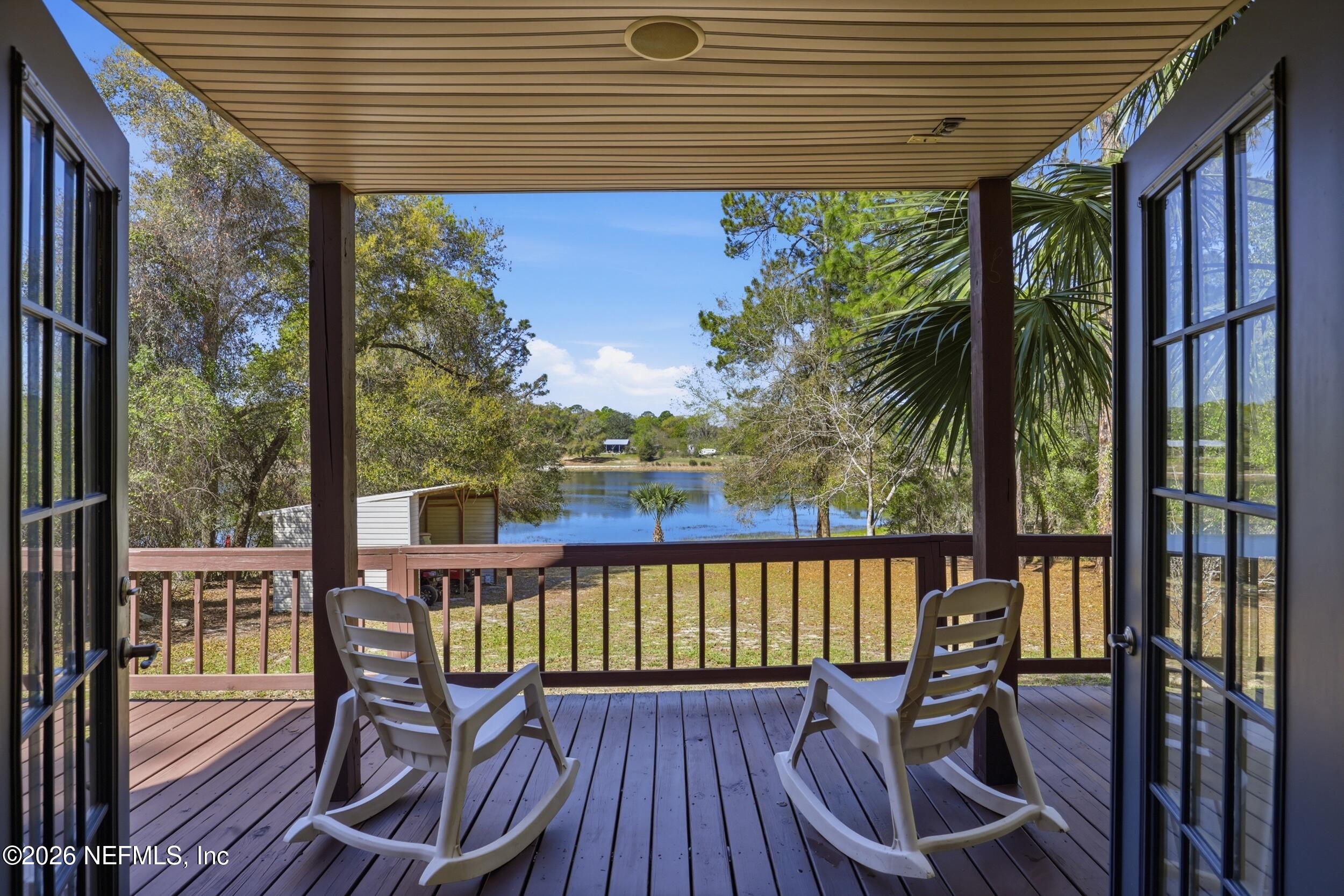 5714 Southeast 4th Avenue Keystone Heights, FL 32656 - Photo 1 of 53 a view of a chairs on the roof deck
