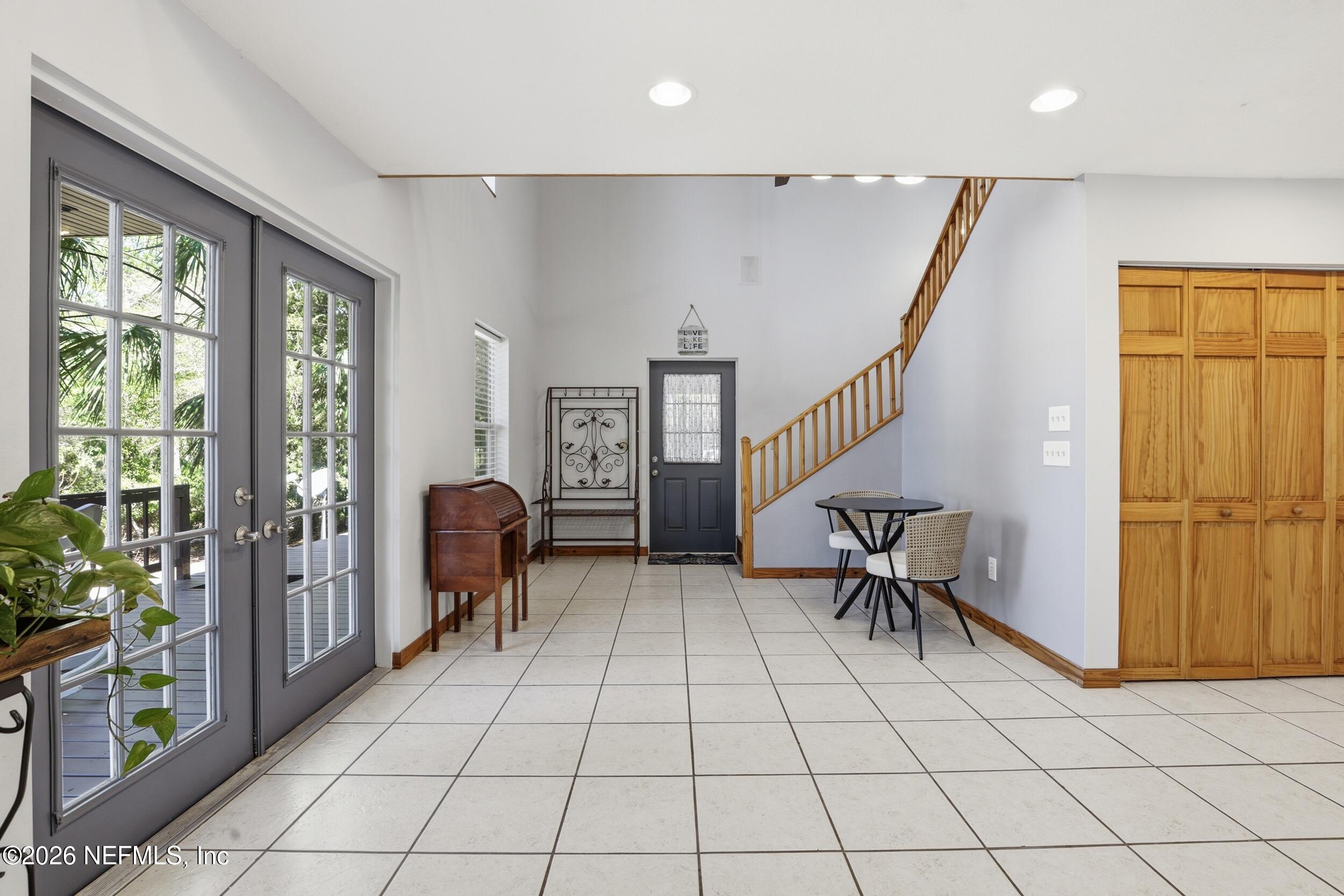5714 Southeast 4th Avenue Keystone Heights, FL 32656 - Photo 14 of 53 a view of a livingroom with furniture and staircase