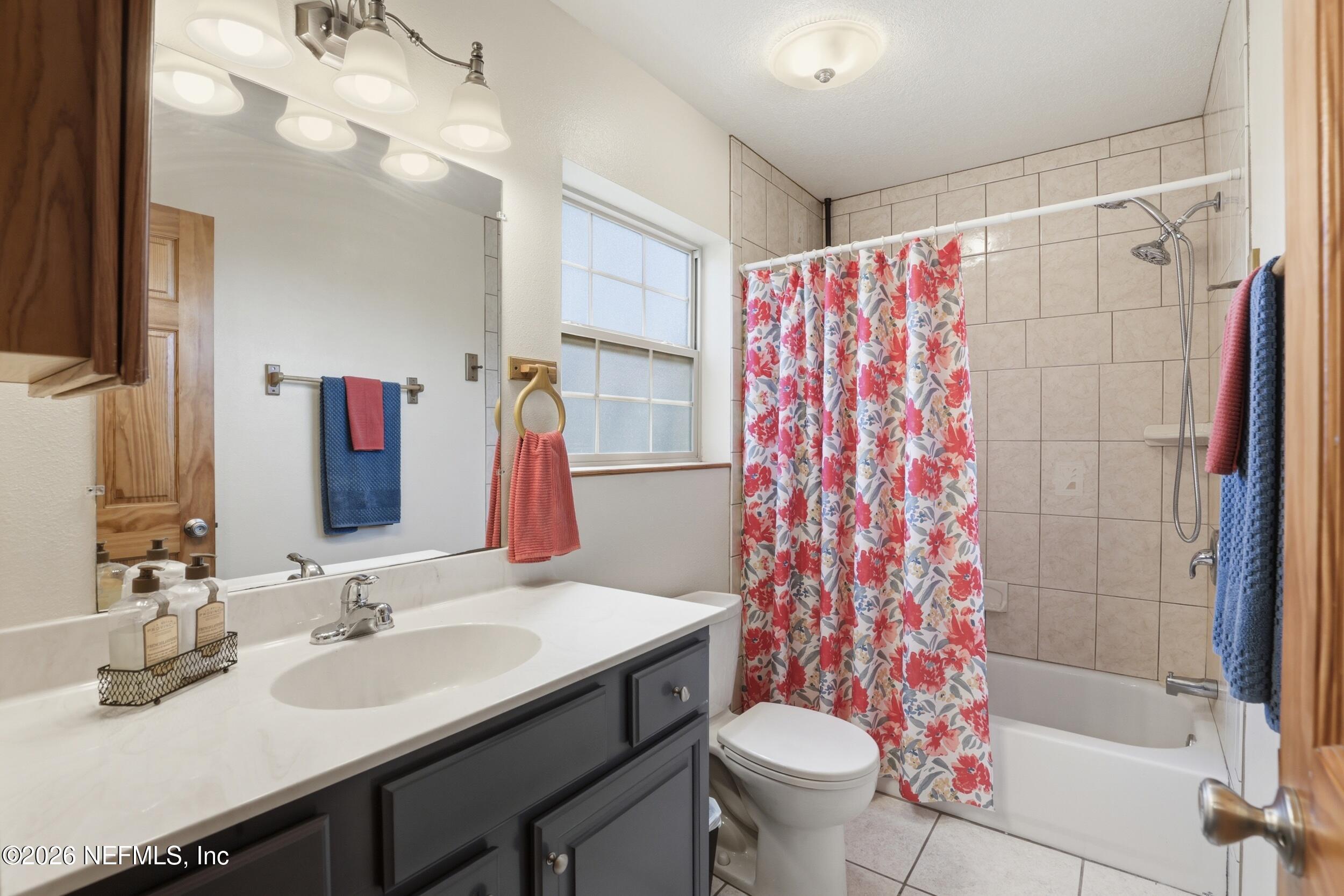 5714 Southeast 4th Avenue Keystone Heights, FL 32656 - Photo 19 of 53 a bathroom with a sink and a mirror