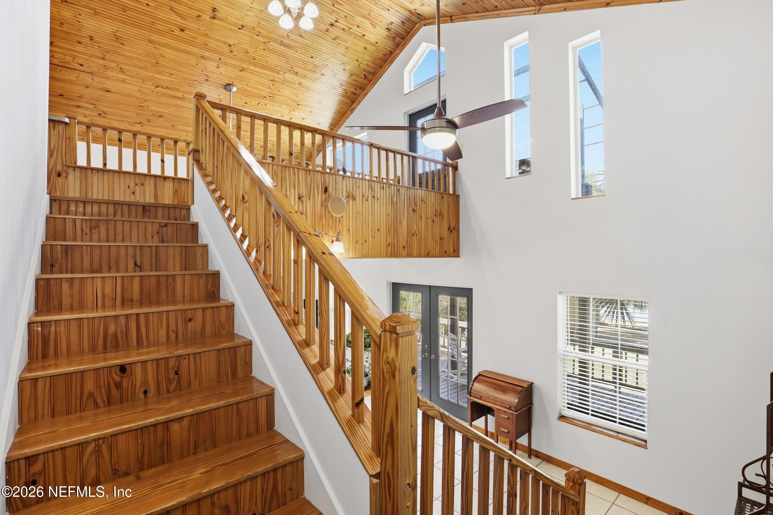 5714 Southeast 4th Avenue Keystone Heights, FL 32656 - Photo 21 of 53 a view of staircase with wooden floor and white walls