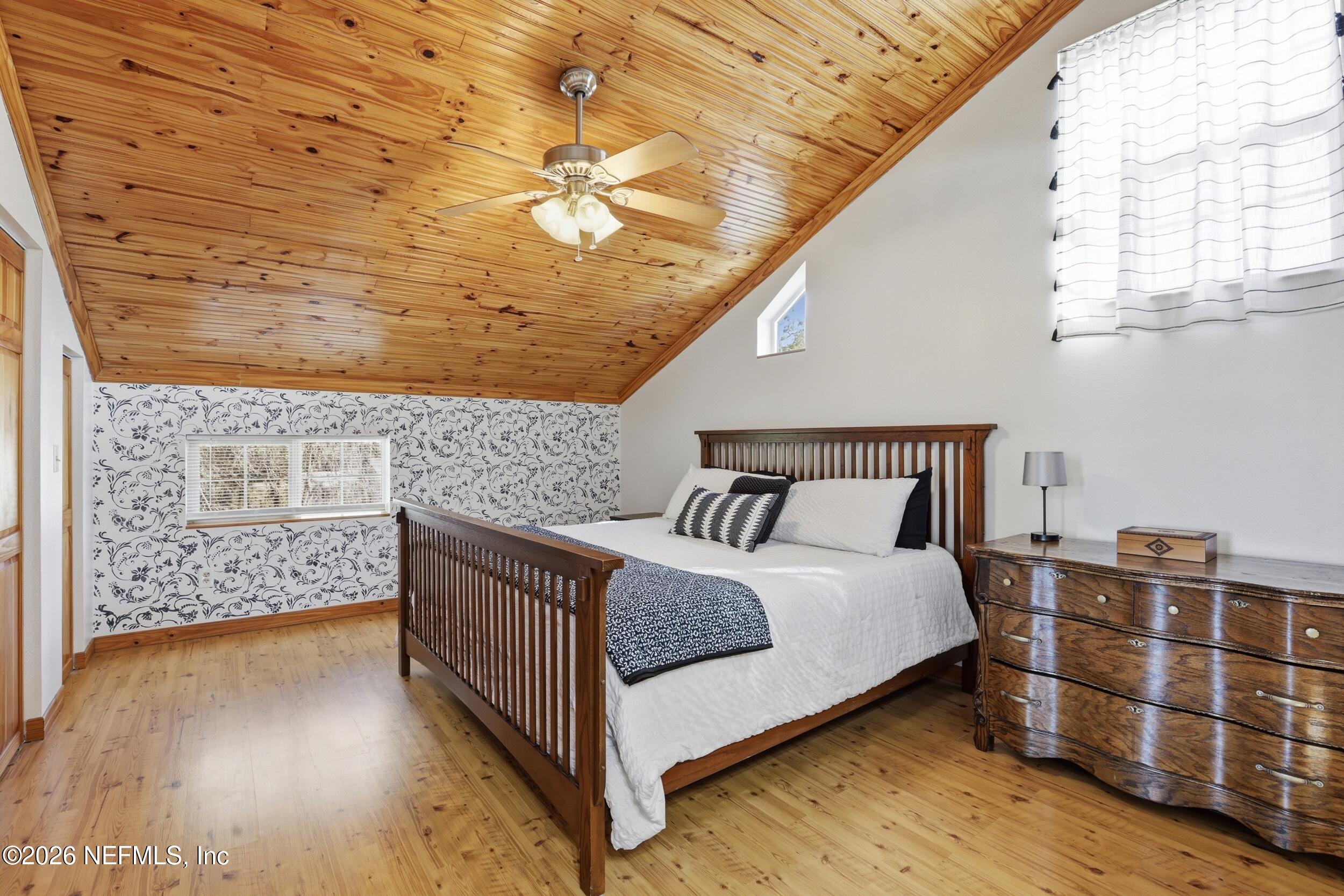 5714 Southeast 4th Avenue Keystone Heights, FL 32656 - Photo 28 of 53 a bedroom with a bed and wooden floor