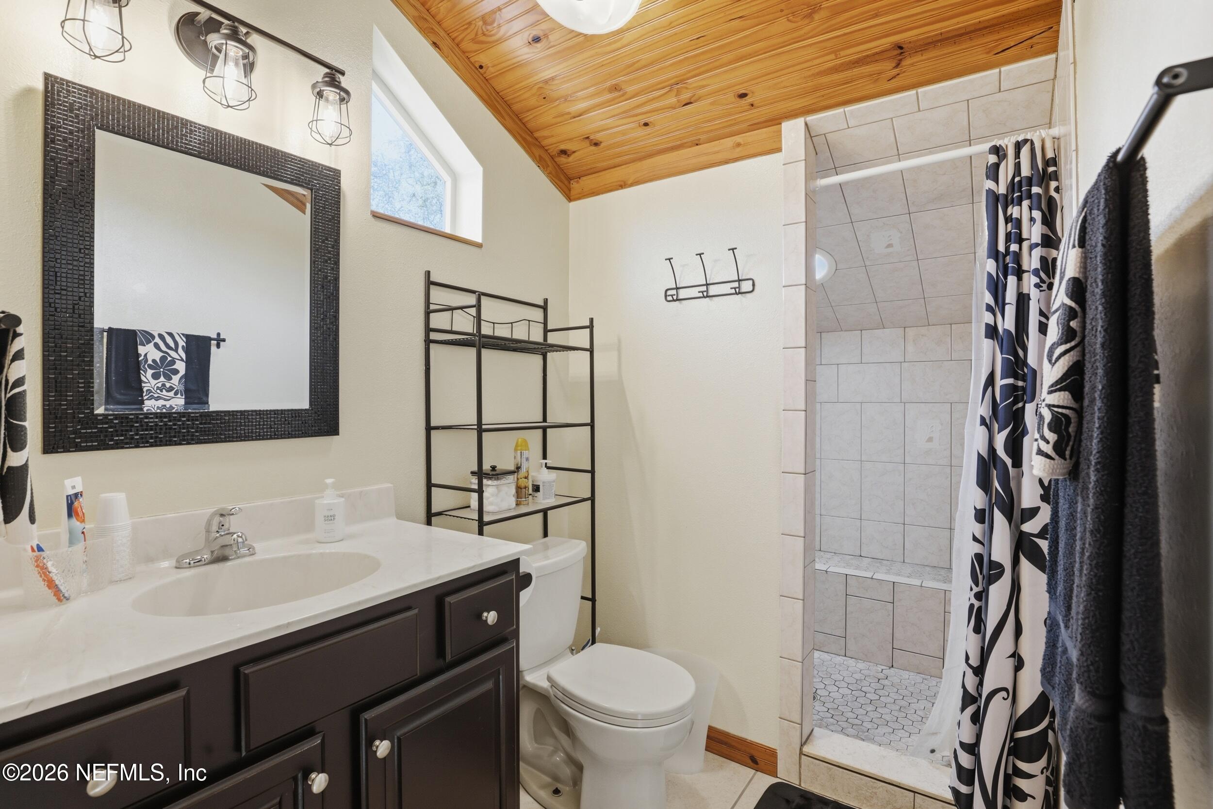 5714 Southeast 4th Avenue Keystone Heights, FL 32656 - Photo 30 of 53 a bathroom with a sink toilet and shower