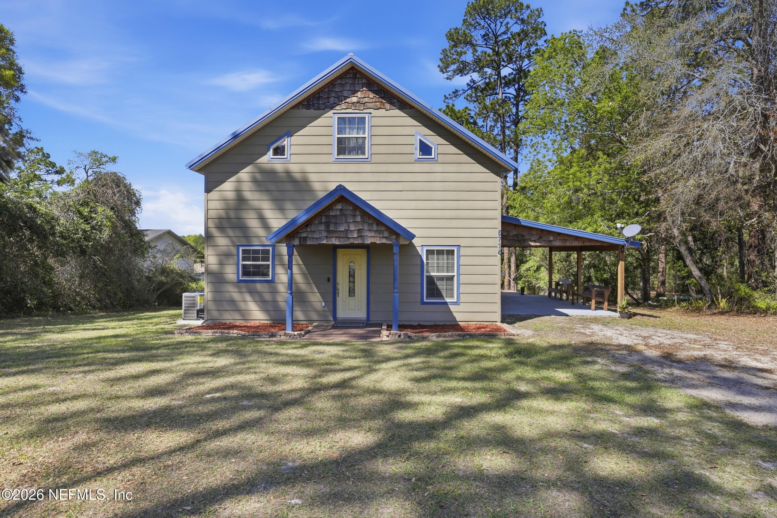 5714 Southeast 4th Avenue Keystone Heights, FL 32656 - Photo 3 of 53 a view of a house with a yard