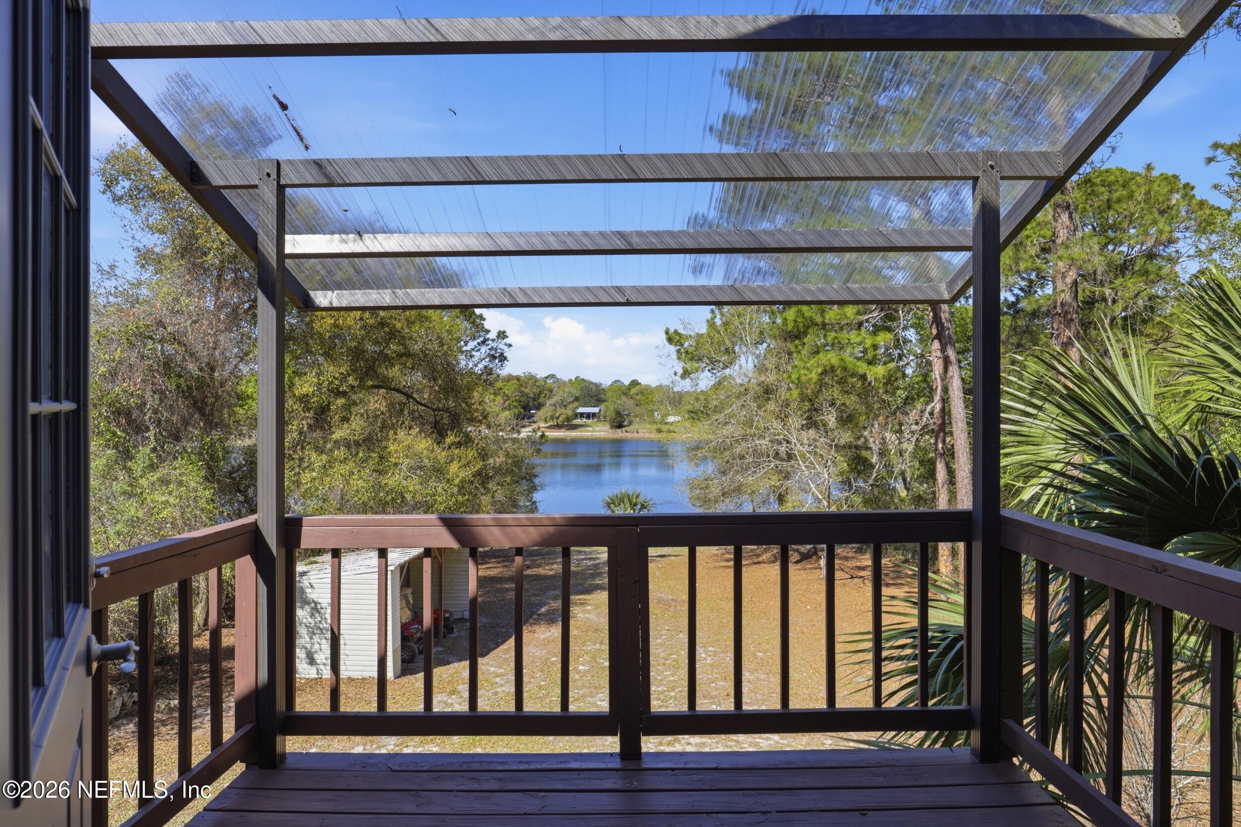 5714 Southeast 4th Avenue Keystone Heights, FL 32656 - Photo 31 of 53 a view of a porch with wooden floor