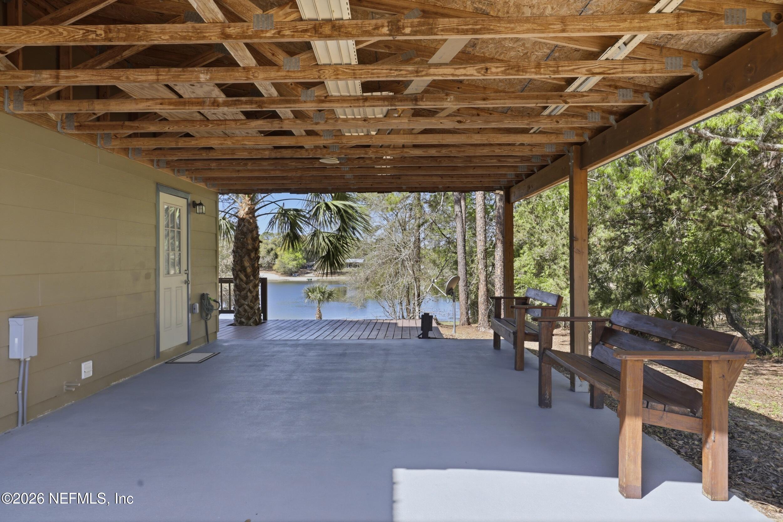 5714 Southeast 4th Avenue Keystone Heights, FL 32656 - Photo 36 of 53 a view of a patio with table and chairs