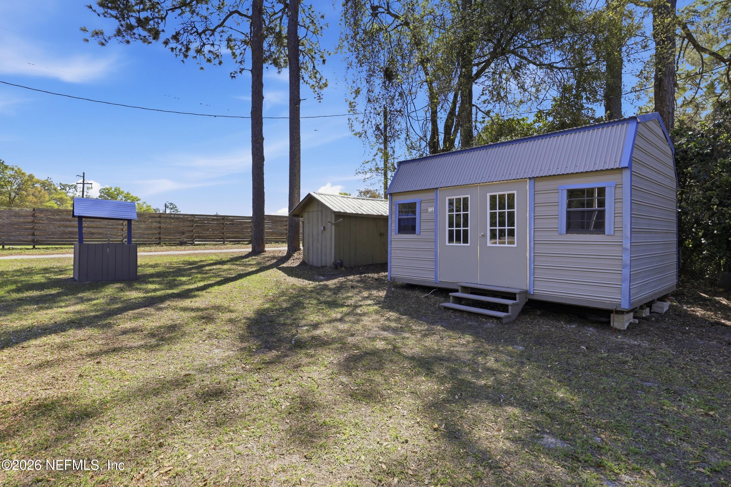 5714 Southeast 4th Avenue Keystone Heights, FL 32656 - Photo 41 of 53 a view of a house with backyard and a tree