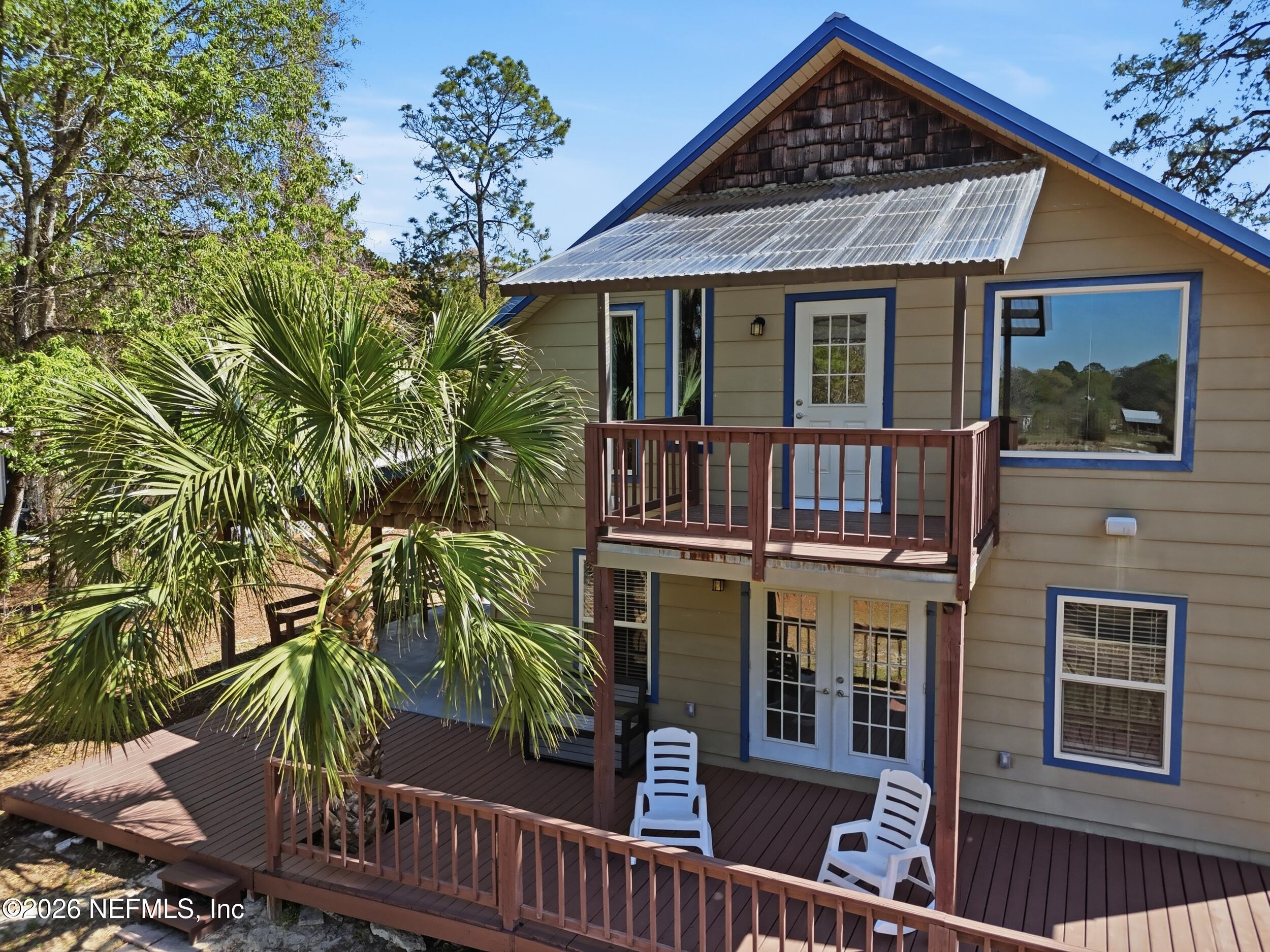 5714 Southeast 4th Avenue Keystone Heights, FL 32656 - Photo 45 of 53 a front view of a house with garden