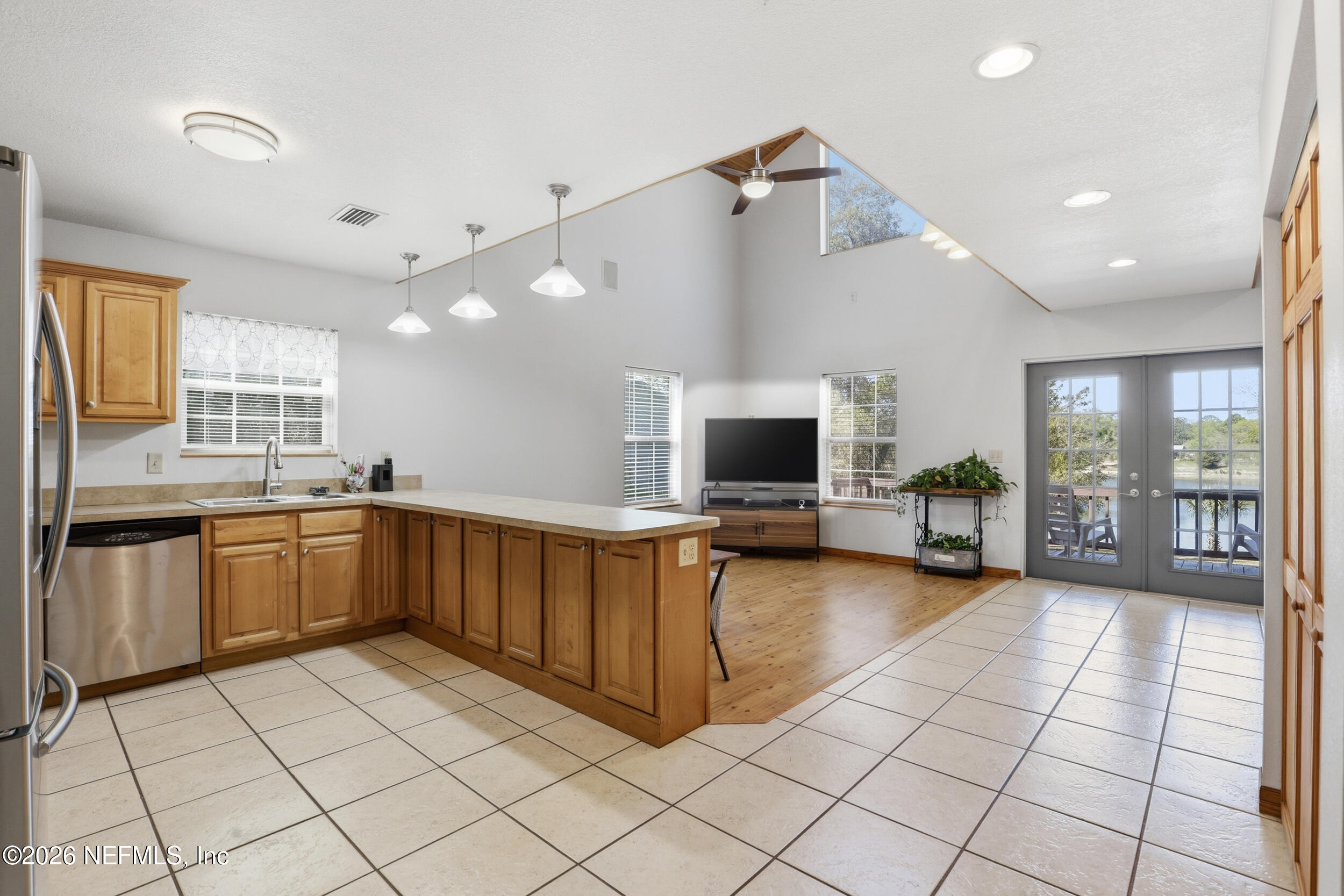 5714 Southeast 4th Avenue Keystone Heights, FL 32656 - Photo 6 of 53 a kitchen with stainless steel appliances a refrigerator and a stove top oven