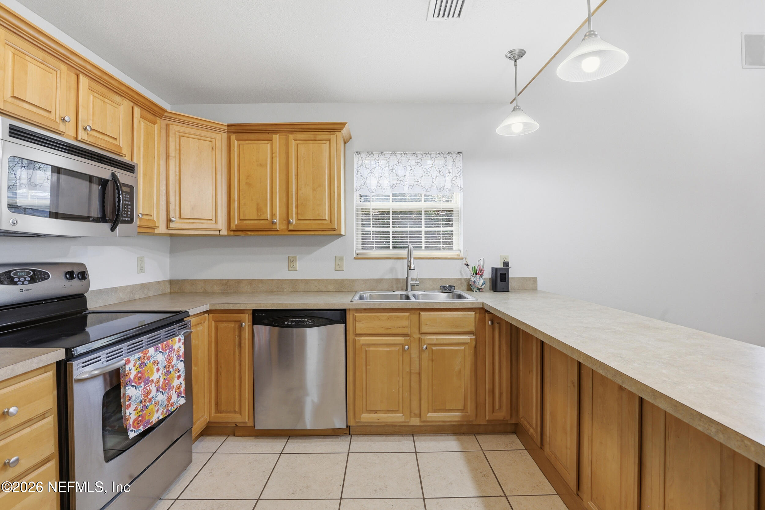 5714 Southeast 4th Avenue Keystone Heights, FL 32656 - Photo 7 of 53 a kitchen with a sink stove top oven and microwave