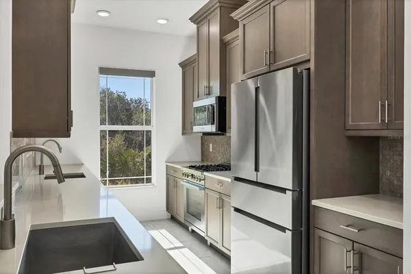 a kitchen with a sink and cabinets